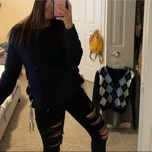 navy blue sweater with ties on the side